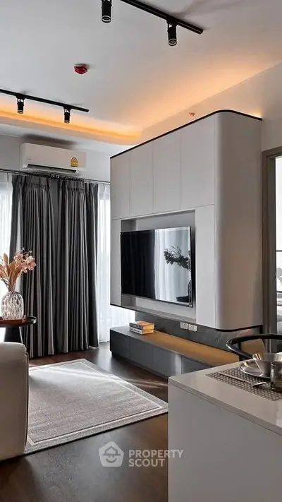 Modern living room with sleek TV unit and elegant decor