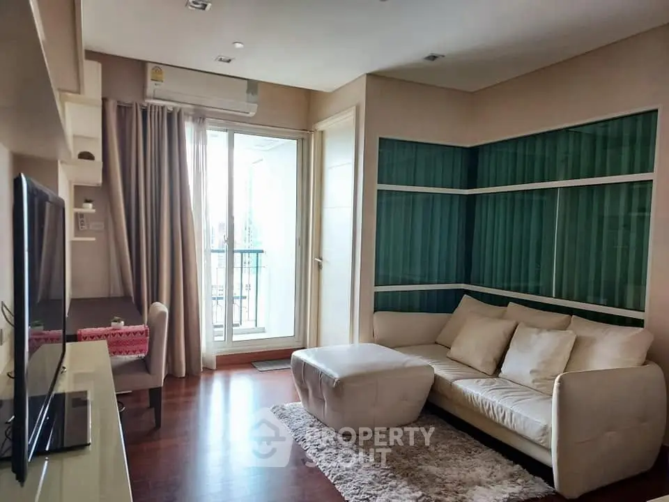 Modern living room with cozy sofa and balcony view in stylish apartment