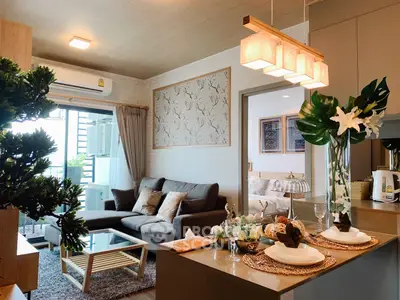 Stylish open-plan living room with modern decor and cozy seating area