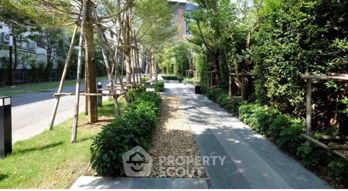Beautifully landscaped garden path with lush greenery and modern design.
