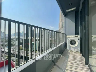 Modern balcony with city view and washing machine, perfect for urban living.