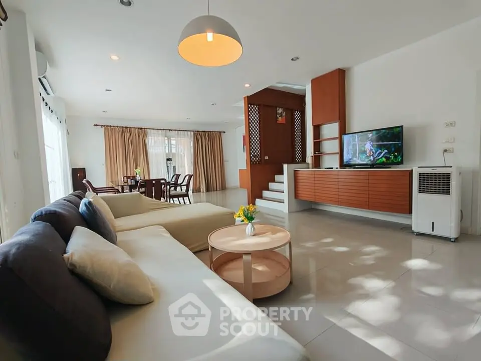 Spacious modern living room with elegant decor and natural light