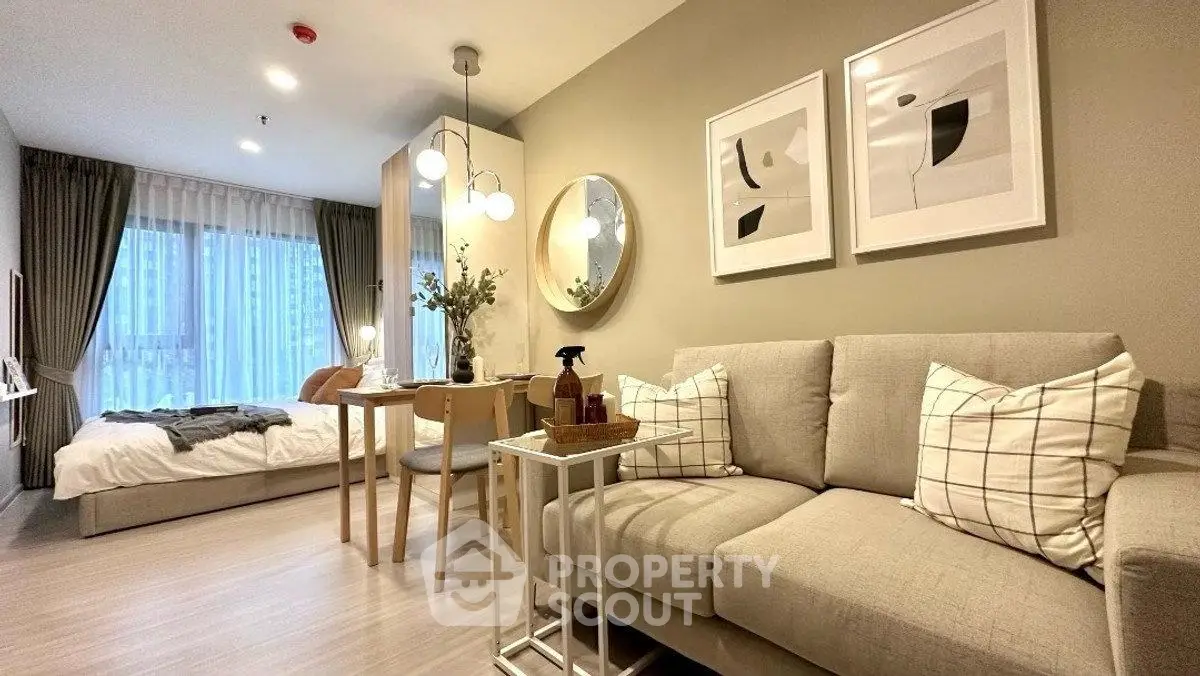 Modern studio apartment with cozy living area and stylish decor