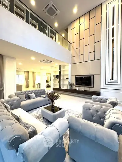 Luxurious modern living room with high ceilings and elegant decor