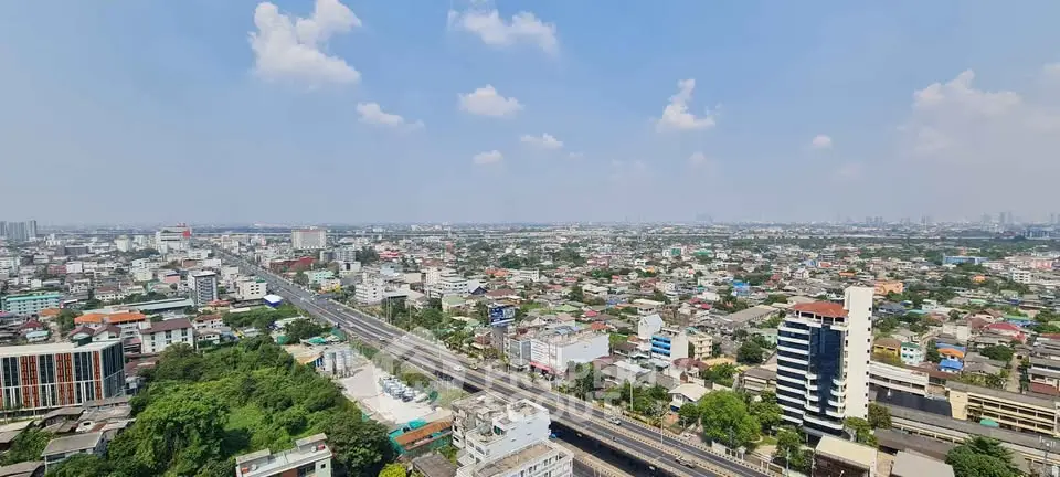 Stunning panoramic cityscape view from high-rise building, showcasing urban skyline and expansive horizon.