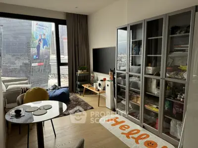 Modern living room with large window and stylish furniture in urban apartment