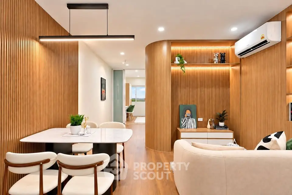 Modern living room with elegant wooden paneling and stylish furniture