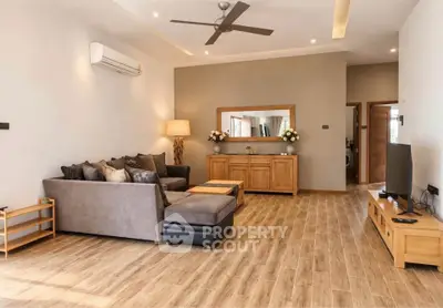 Spacious modern living room with stylish decor and wooden flooring
