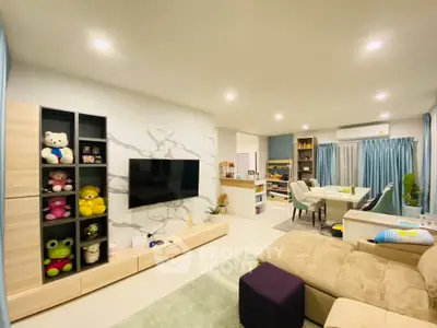 Spacious modern living room with plush seating and entertainment center