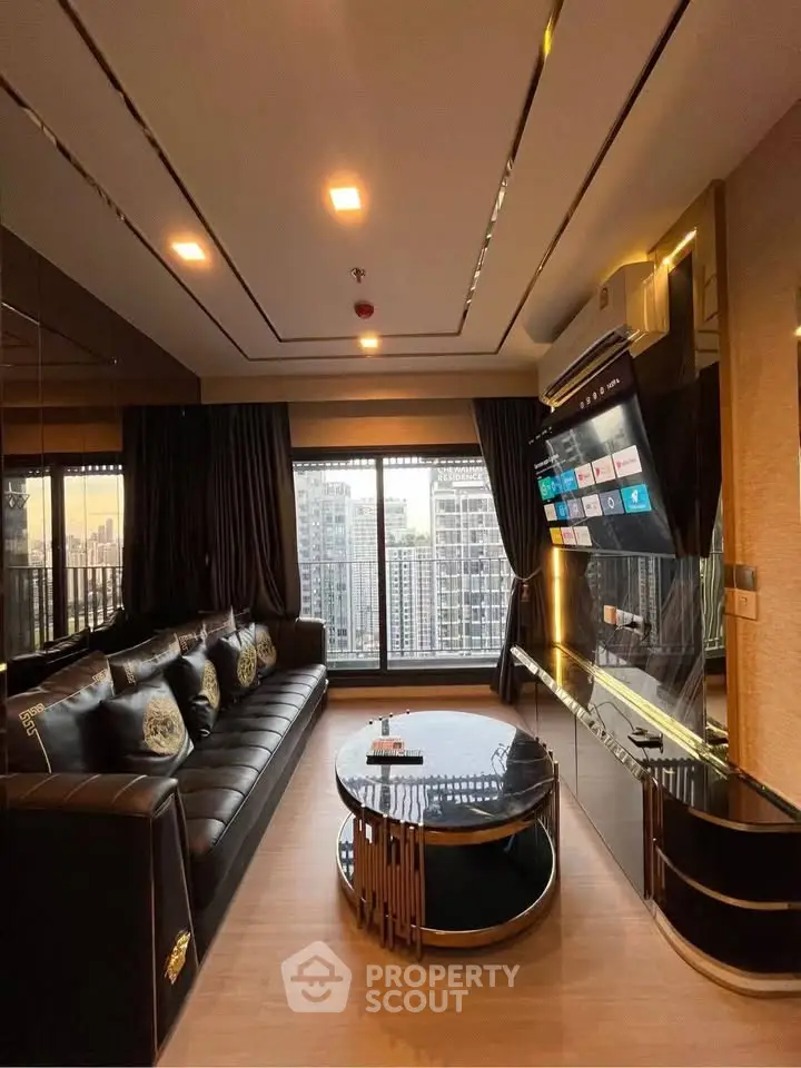Luxurious living room with modern decor and stunning city view through large windows.