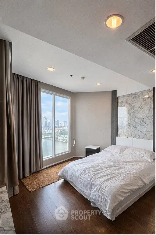 Luxurious bedroom with stunning city view and elegant decor