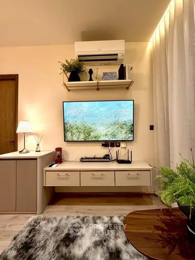 Stylish living room with modern TV setup and cozy decor