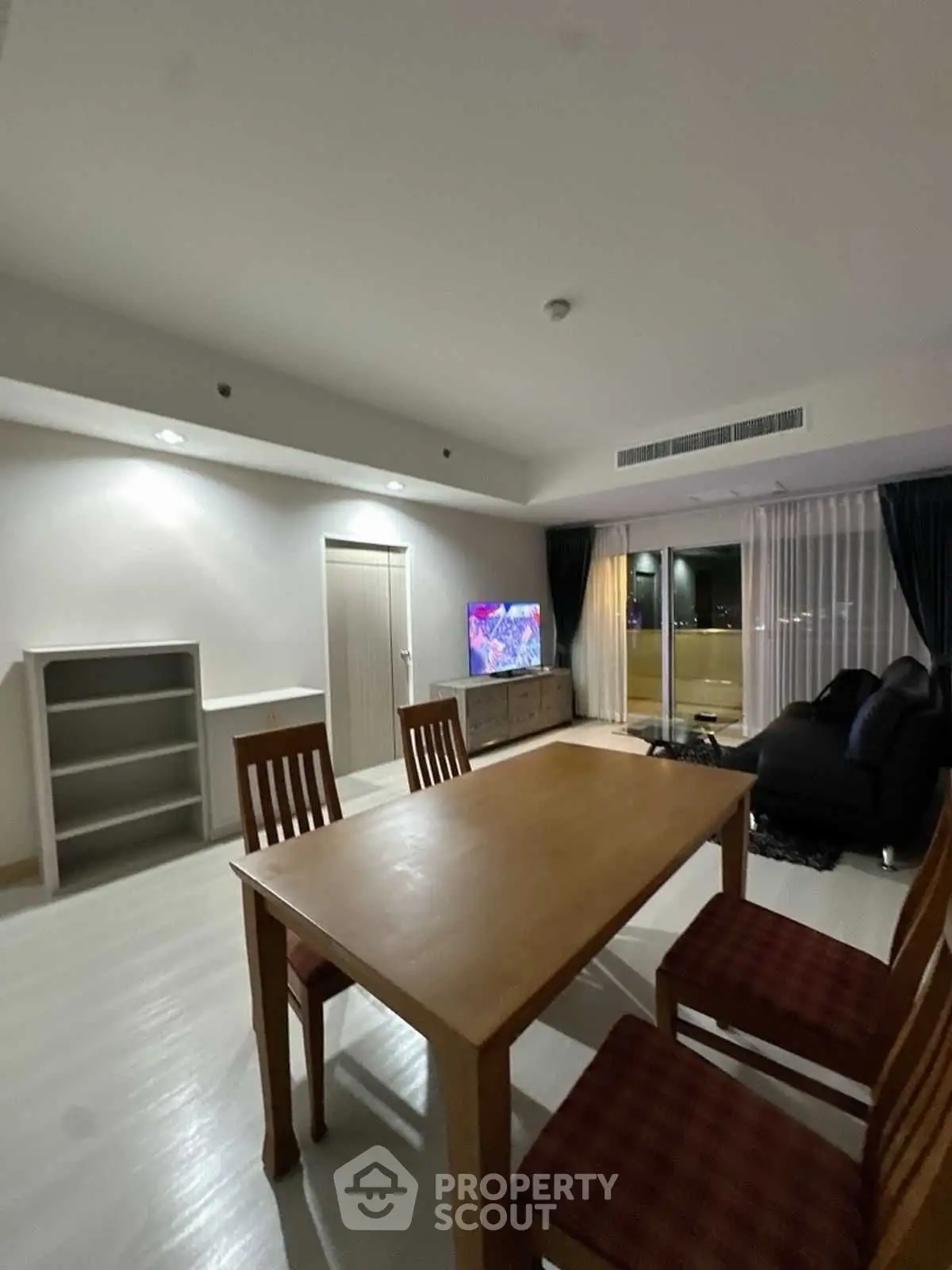 Spacious living room with modern furniture and large windows for natural light.