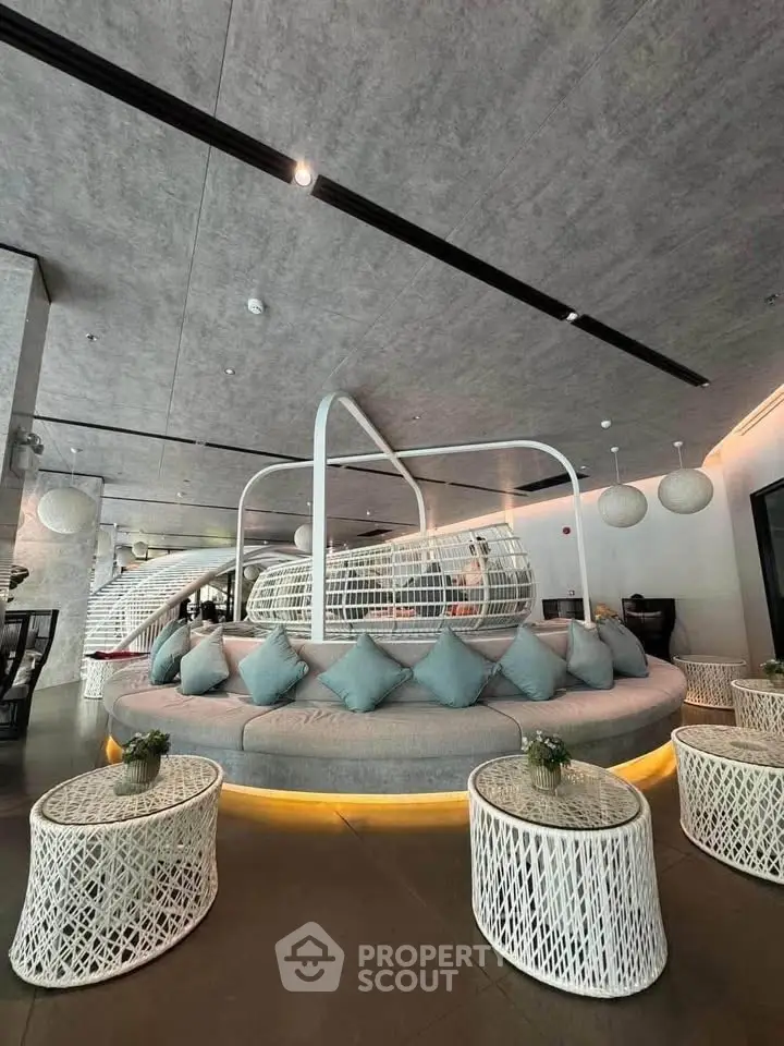 Luxurious modern lobby with stylish seating and ambient lighting in a contemporary building.