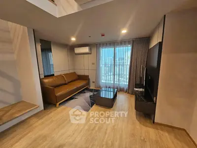 Modern living room with stylish furniture and natural light