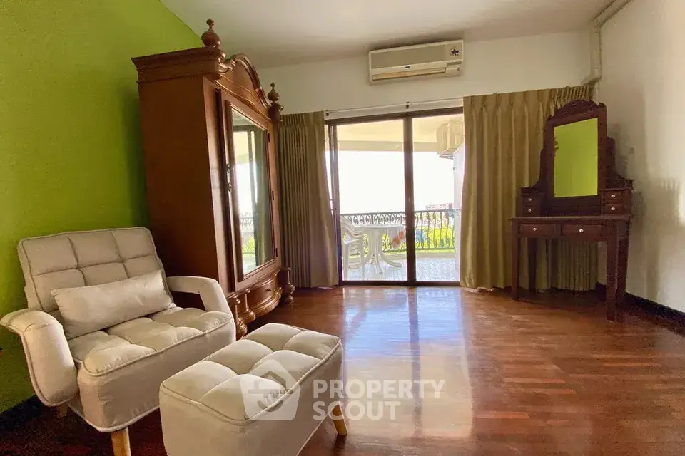 Spacious living room with elegant furniture and balcony access