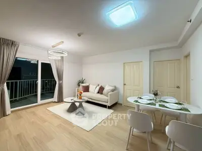 Modern living room with elegant decor and balcony access