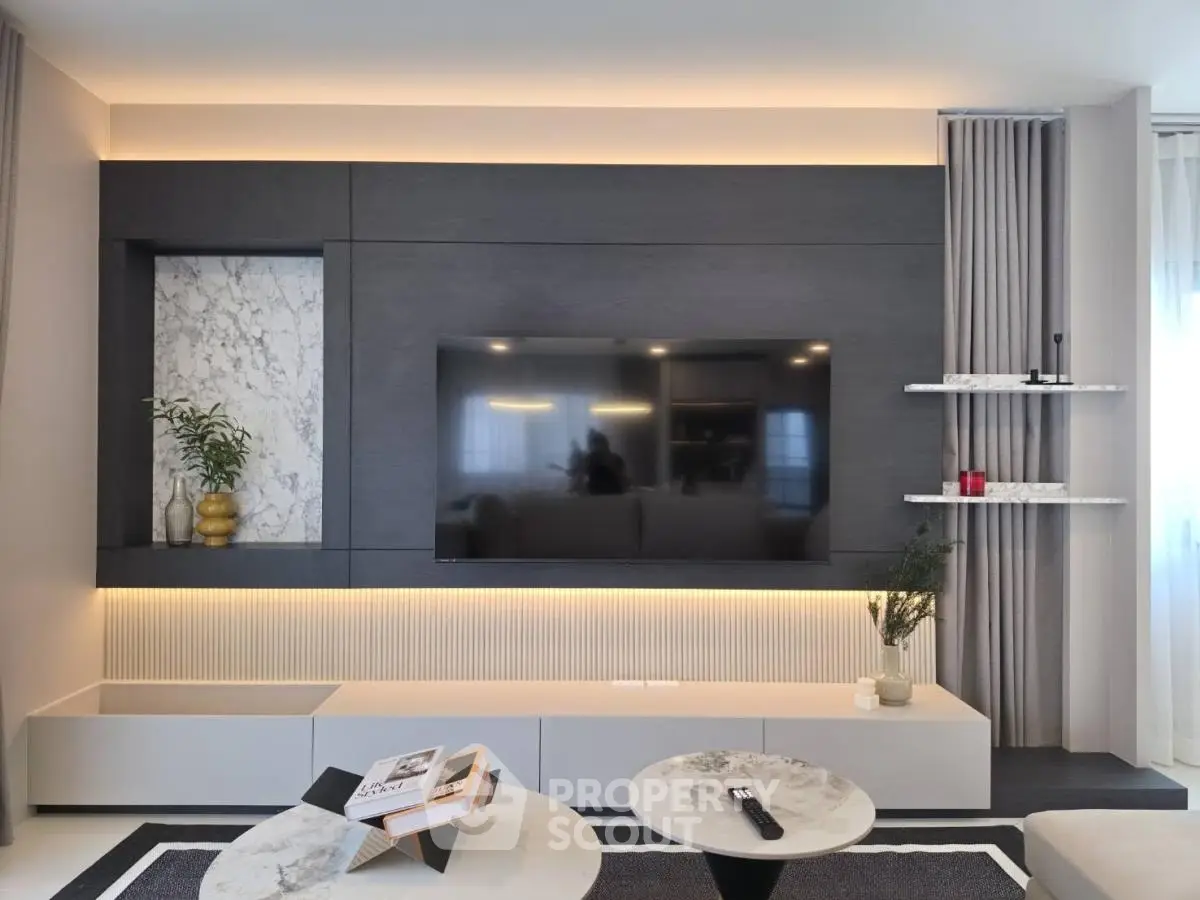 Modern living room with sleek TV setup and elegant decor
