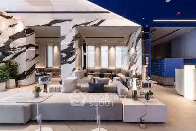 Luxurious modern living room with elegant decor and spacious seating area.