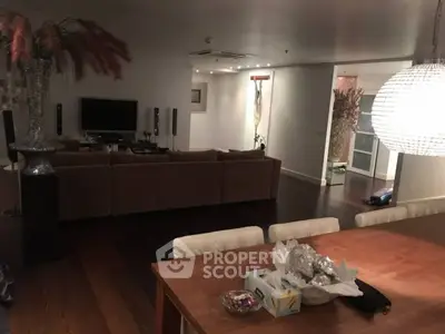 Spacious living room with elegant decor and modern lighting