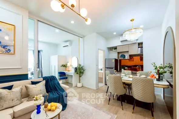 Modern open-plan living and dining area with elegant decor and cozy ambiance.
