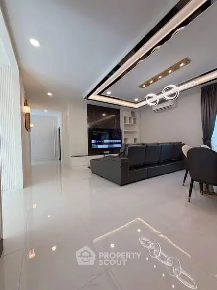 Luxurious modern living room with sleek design and elegant lighting, perfect for stylish urban living.