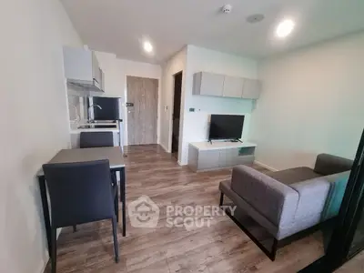 Modern living room with open kitchen and stylish furniture in a cozy apartment