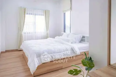 Bright and airy bedroom with large windows and modern decor