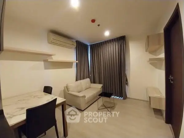 Modern living room with sleek furniture and air conditioning