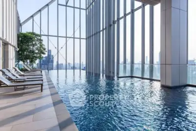 Luxurious rooftop pool with stunning city skyline views and modern architecture.