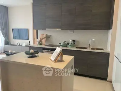 Modern kitchen with sleek cabinetry and island in open layout design