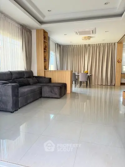 Spacious modern living room with elegant decor and ample natural light