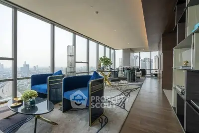 Luxurious high-rise living room with panoramic city views and modern decor.