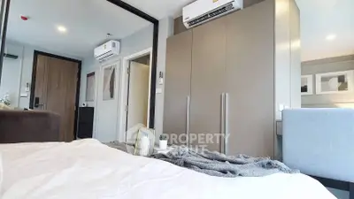 Modern bedroom with sleek design and air conditioning unit