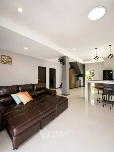 Spacious modern living room with open kitchen and stylish decor