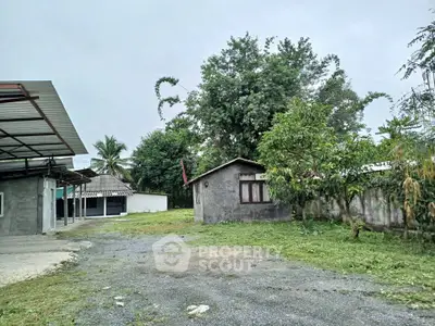 Charming rural property with spacious yard and lush greenery, perfect for serene living.