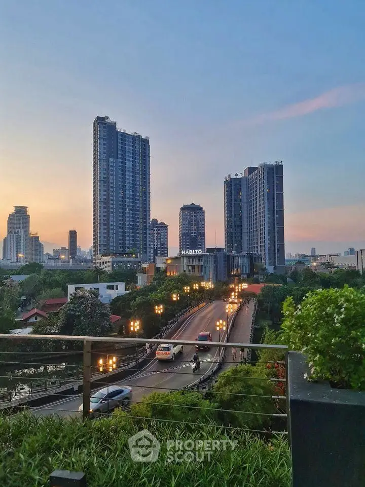 Stunning cityscape view with modern high-rise buildings at sunset, perfect for urban living enthusiasts.