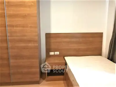 Modern bedroom with wooden furniture and minimalist design