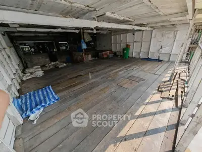 Spacious wooden interior with rustic charm, ideal for creative renovation or storage space.