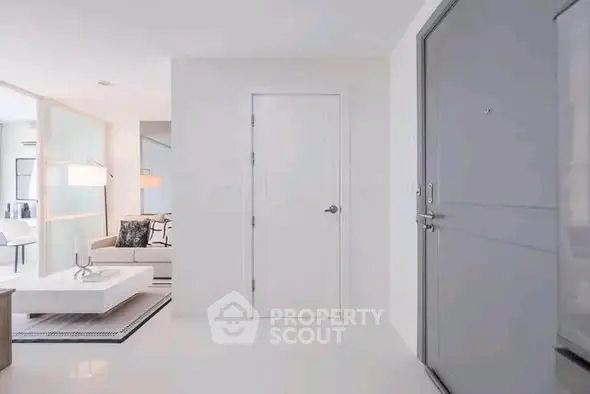 Modern apartment entrance with sleek interior design and cozy living area