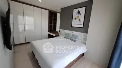 Modern bedroom with stylish decor and ample storage space