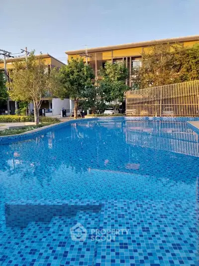 Luxurious residential pool with modern design and serene surroundings.