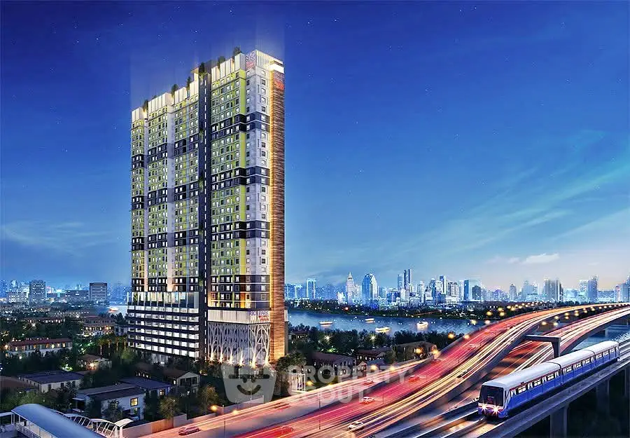 Stunning high-rise building with city skyline and river view at night