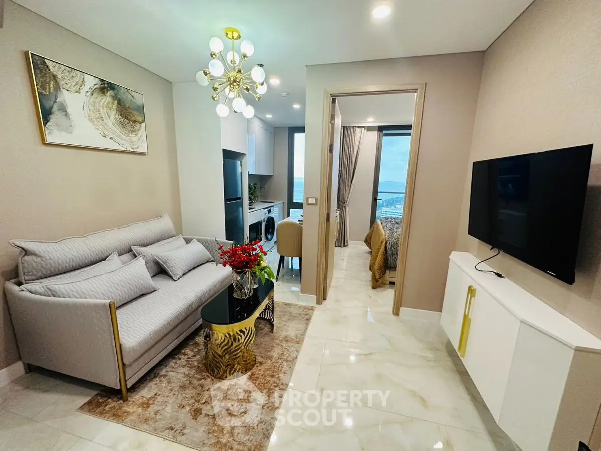 Luxurious modern living room with elegant decor and open kitchen layout.