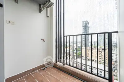 High-rise balcony with city view and safety netting, perfect for urban living.