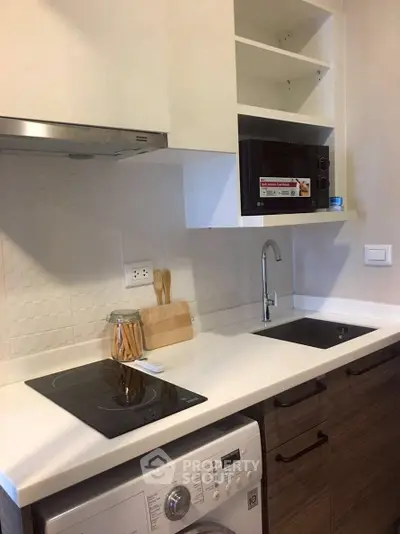 Modern kitchen with sleek appliances and stylish cabinetry