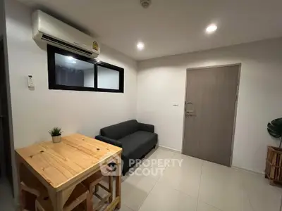 Cozy living room with modern furniture and air conditioning