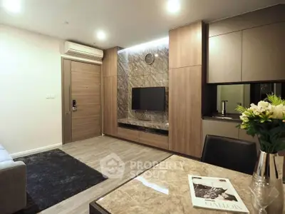 Modern living room with sleek design and integrated TV unit, featuring elegant wood paneling.