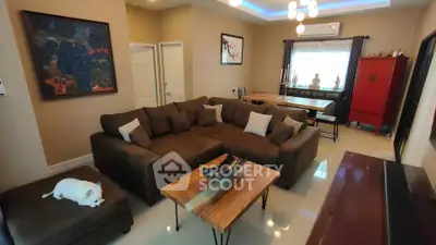 Spacious living room with modern decor and cozy seating area