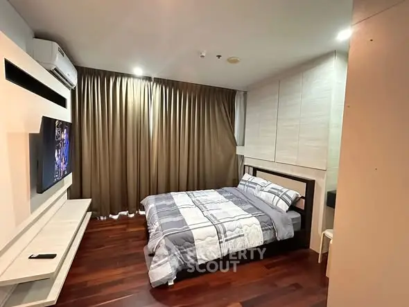 Cozy bedroom with modern decor and wooden flooring